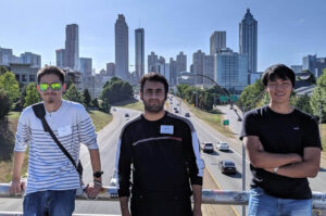 OU international students pose in front of the Atlanta Skyline on MLK, Jr. bridge.