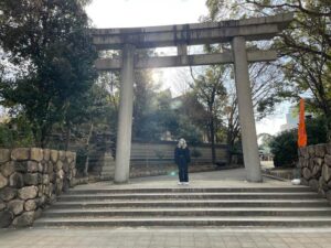 Savannah Hoggat stands under an archway in Osaka, Japan.