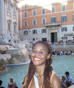 Kennedy Bell '25 poses in front of the Trevi Fountain in Rome.