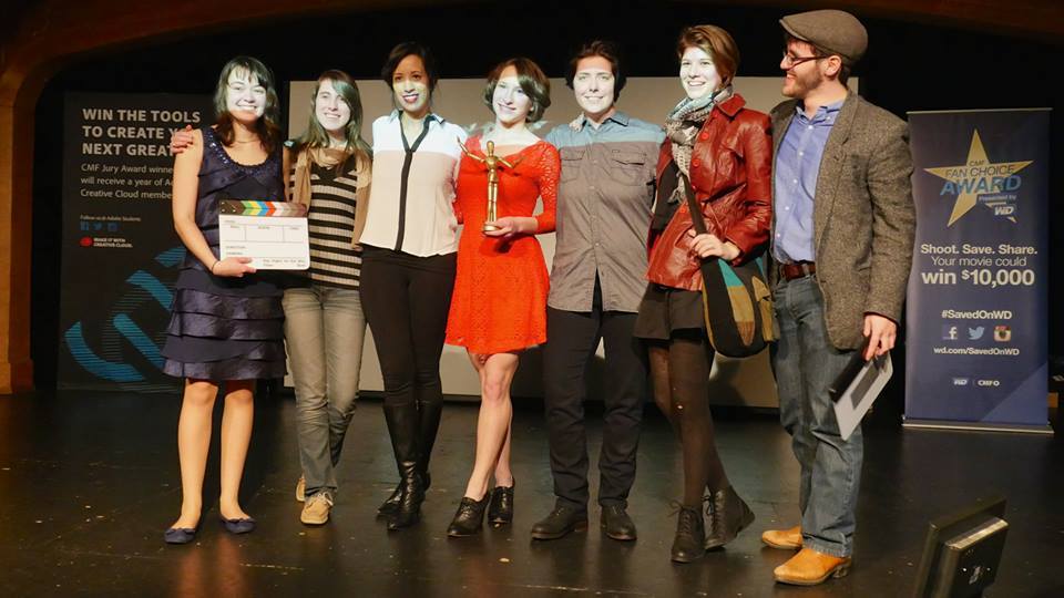 The team accepts their CMF award at the Oglethorpe University Red Carpet premiere event