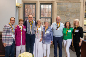 Members of the class of 1974 stand together.