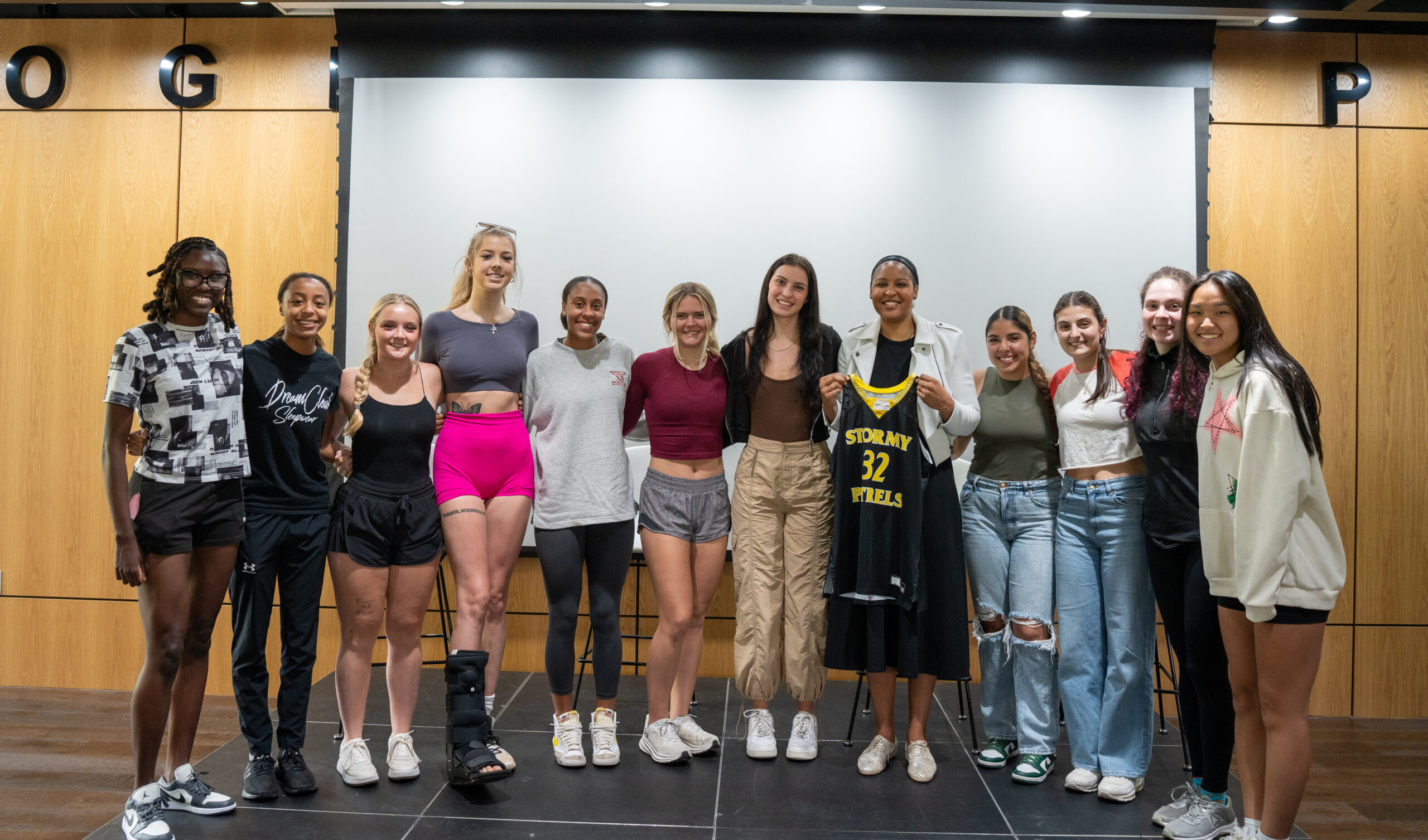 WNBA icon Maya Moore and members of the Oglethorpe University Women's Basketball Team pose together