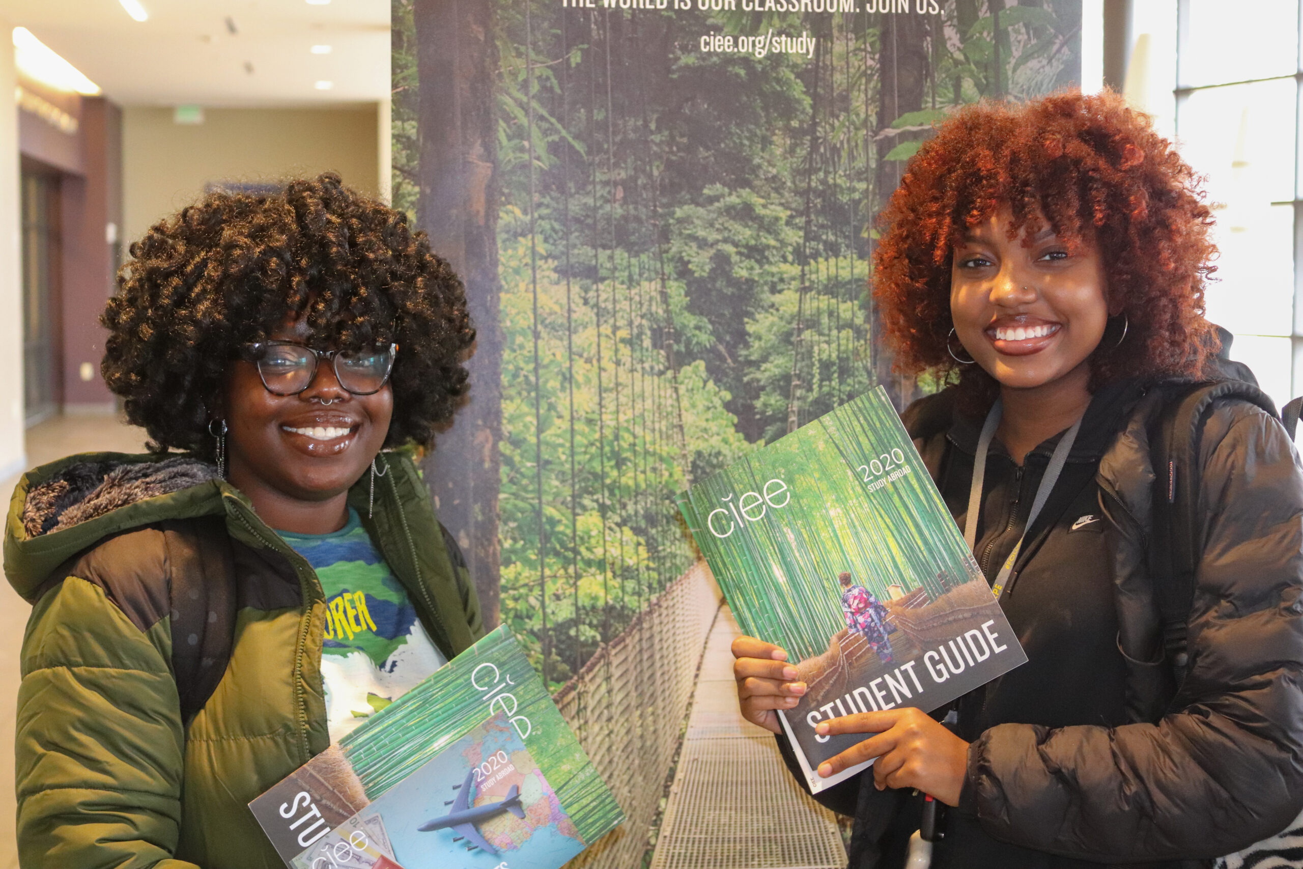 Two students pose at the passport caravan event