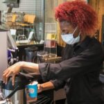 Barista prepares a drink at Stormy Brews