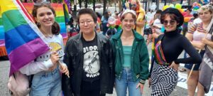Oglethorpe University students with pride flags at the 2022 Atlanta Pride parade