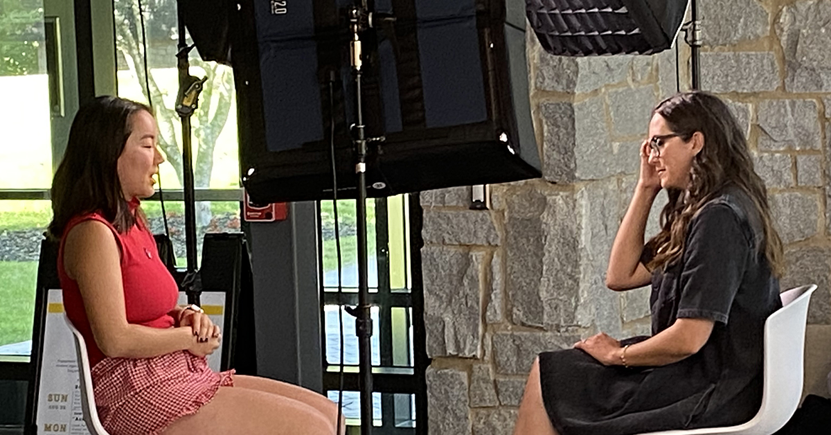TV reporter interviews a student