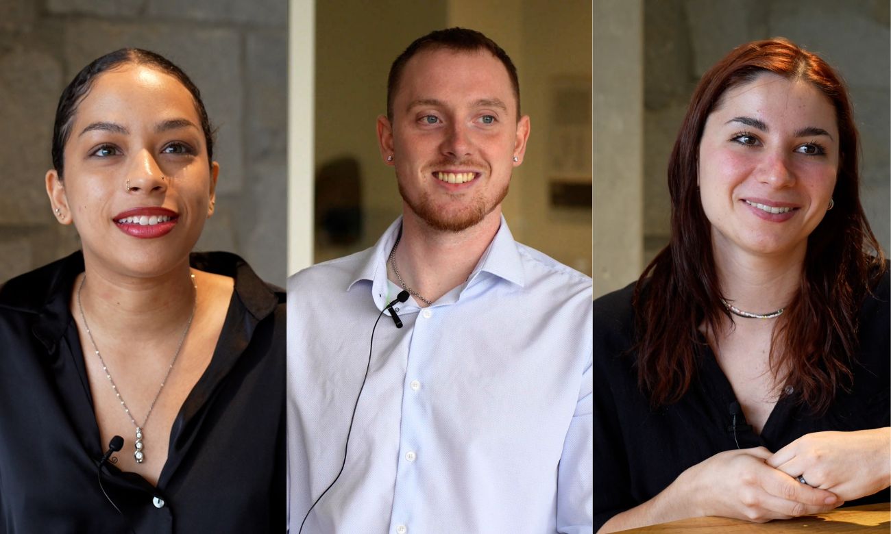 Three students smile as they discuss the actuarial science program