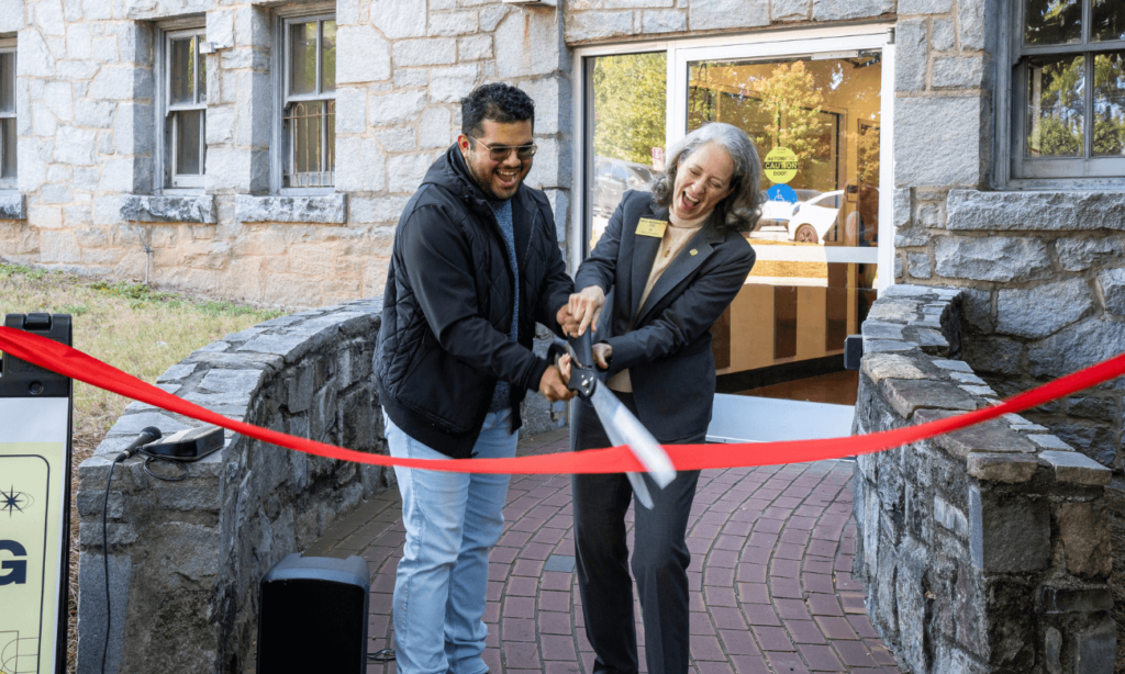 David Martinez, Commuter Student Association President, and President McClymond cut the ribbon for the grand opening of the commuter lounge.