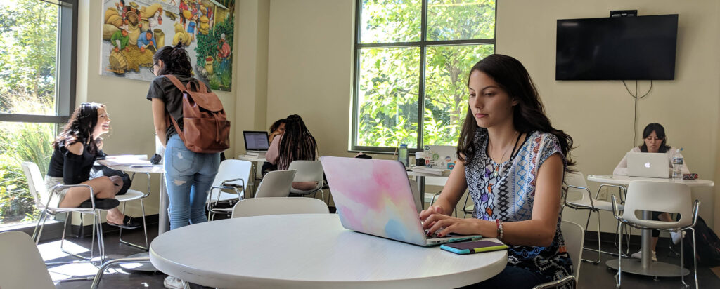 Students study with laptops in the TLCC