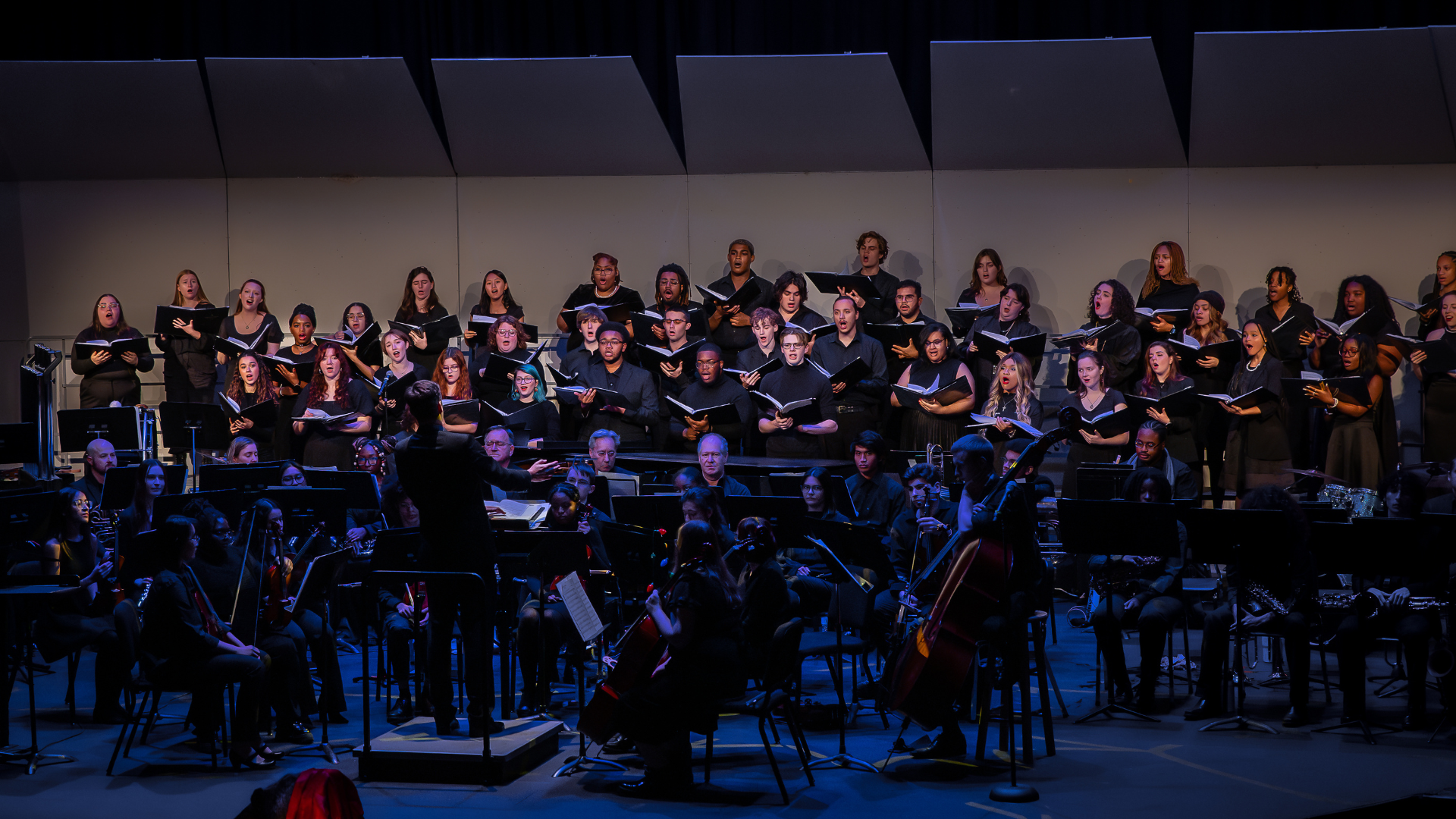 The Jazzy Petrels, the Oglethorpe University Singers and Chorale, and the Oglethorpe University Symphony performing on stage at the Boar's Head 2024 holiday concert.