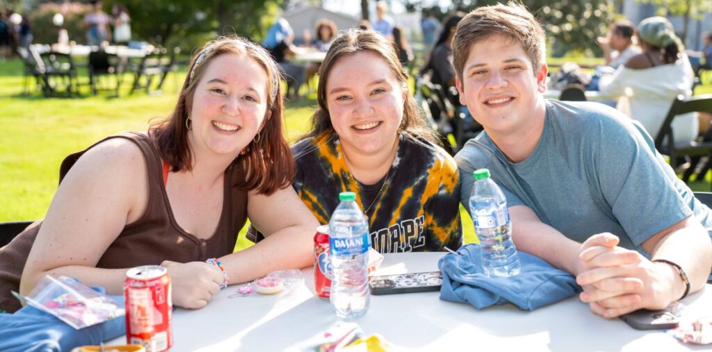 Students outside at lunch on the quad.
