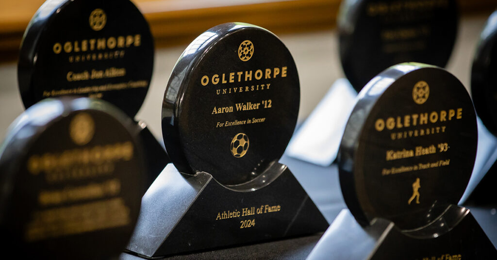 Alumni Awards are placed on a table to be distributed.