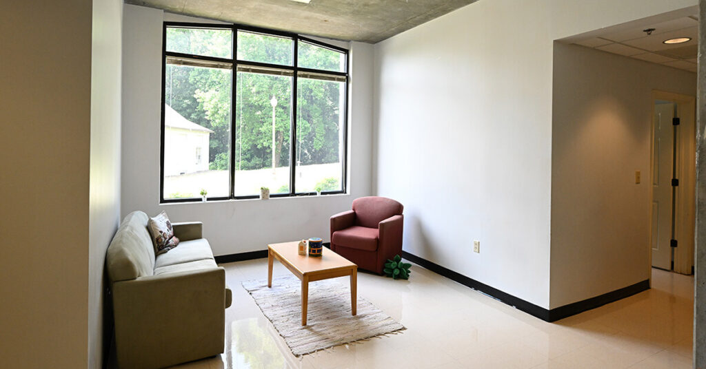 The common room for suites in Bowden-Magbee hall is spacious and well-lit with natural light.