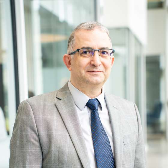 A headshot of Ahmet Akin