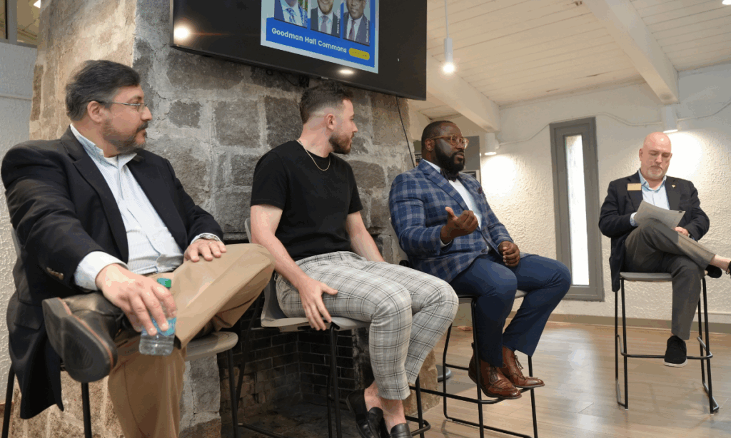 Three alumni speak on a panel.