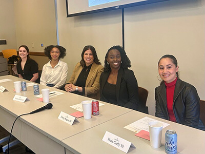 Alumni volunteer for a panel on campus.