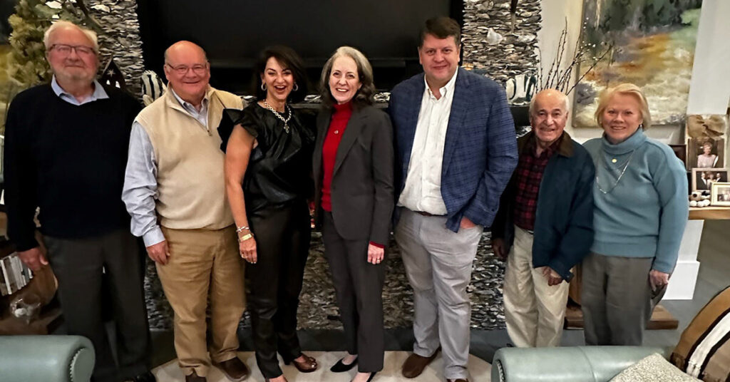 President MyClymond stands with Oglethorpe University alumni and supporters.