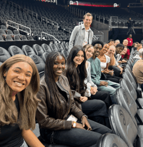 Stuart Spiers and Oglethorpe students sit courtside at the Hawks game.