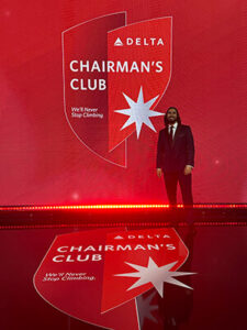 Johann Hassanally '14 in a tux at the Delta Airlines Chairman's Club.