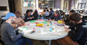 Volunteers create cards at the MLK, Jr. Day of Service 2024.