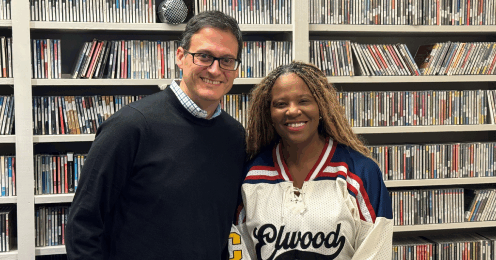 Two faculty members posing at WABE Studio.