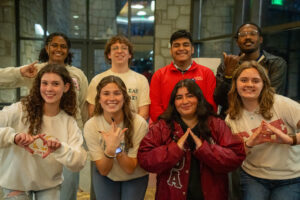 Representatives of Oglethorpe's 8 greek organizations wearing their organization's merch. 