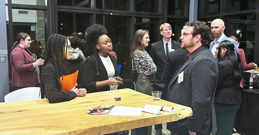 Students mingle with Alumni at a mixer in Cousins Center.