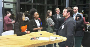 Students mingle with Alumni at a mixer in Cousins Center.