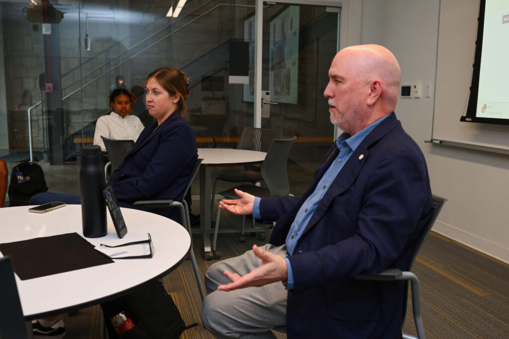 Stephen Craft speaks to a group of students at the Hammack School of Business.