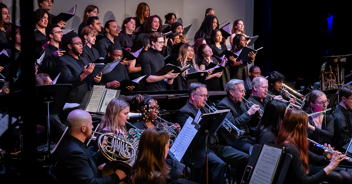Oglethorpe University Symphony and Singers perform on stage.