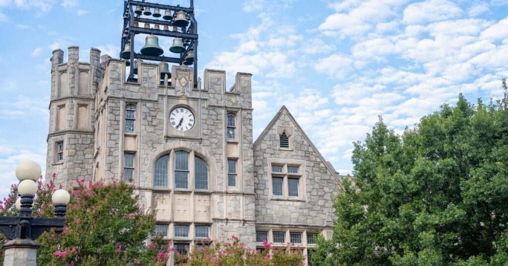 Green trees and a blue sky frame Oglethorpe University's Lupton Hall