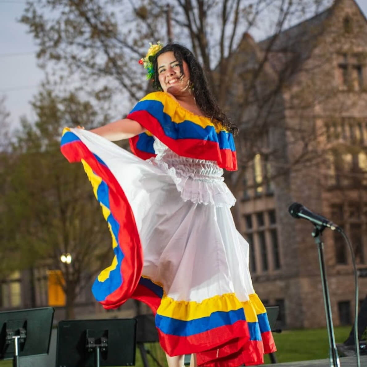 Brigith dances in traditional dress at World Showcase on the academic quad.