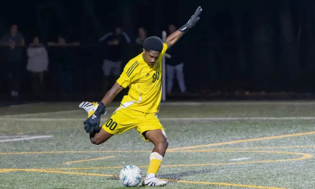 Sebastian Lewis '29 kicks the soccer ball