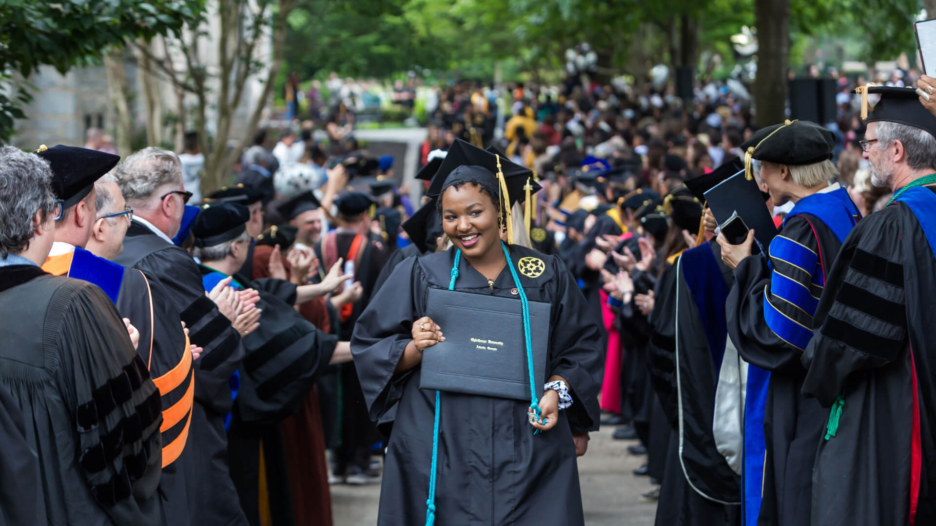 Faculty celebrate Oglethorpe University graduates at commencement.